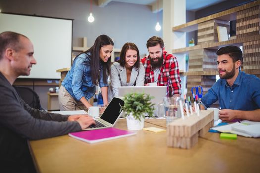 Business people discussing during meeting in creative office