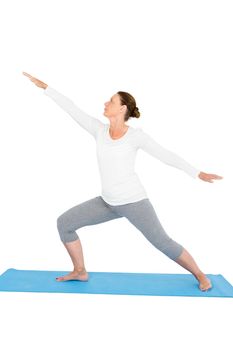 Full length of woman with arms outstretched while exercising on while background