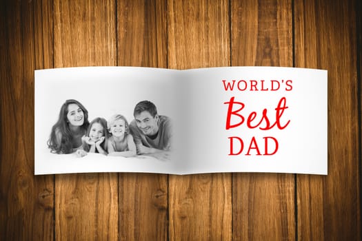 Attractive smiling father with family against overhead of wooden planks