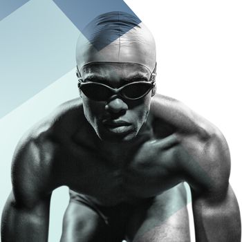 Swimmer ready to dive against colored background