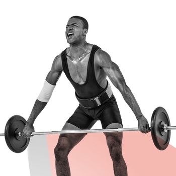 Bodybuilder lifting heavy barbell weights against colored background