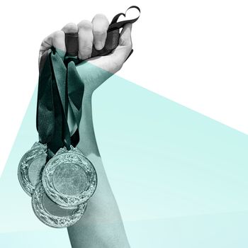 Hand holding three medals on white background against blue colors