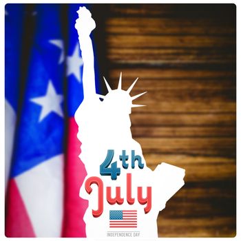 Independence day graphic against usa flag on table