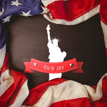 Independence day graphic against american flag on chalkboard