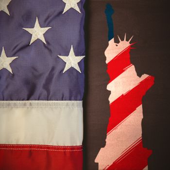 Focus on liberty statue  against american flag on chalkboard