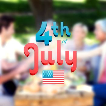 Independence day graphic against happy family toasting in the park 