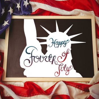 Independence day graphic against american flag on chalkboard