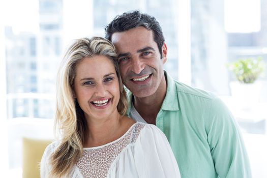 Portrait of smiling romantic couple at home