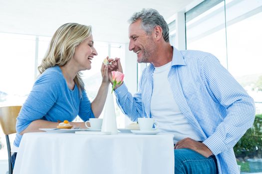 Romantic mature couple sitting at restaurant