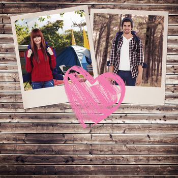 Smiling hipster woman with a travel bag taking selfie against wooden planks background