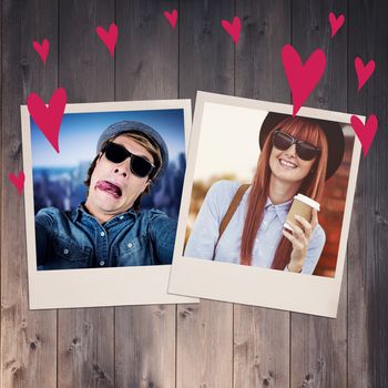 Smiling hipster woman drinking coffee against wooden planks