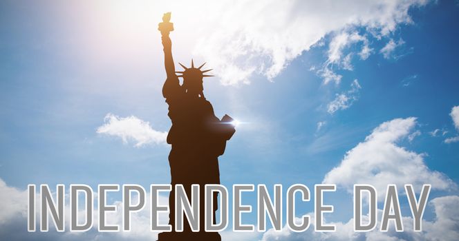 Independence day graphic against blue sky