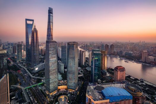 night view of illuminated Lujiazui skyline and Ring Road Circular Footbridge, Shanghai, China