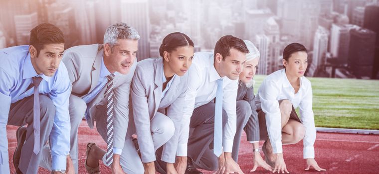 Business people preparing to run  against white background with vignette