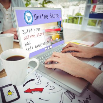 Screen of an online store against creative business team working together