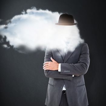 Serious businessman against grey background