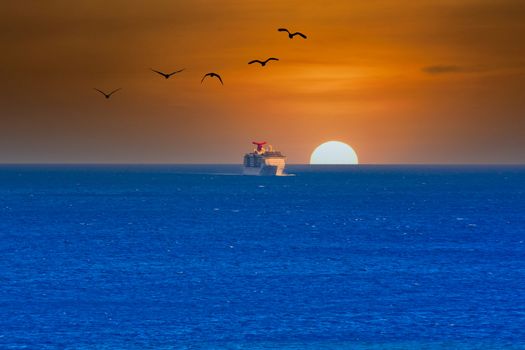 A cruise ship sailing over the distant horizon