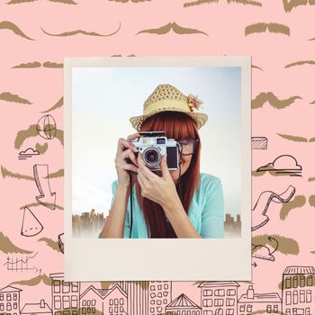 Portrait of a smiling hipster woman holding retro camera against composite image of mustaches