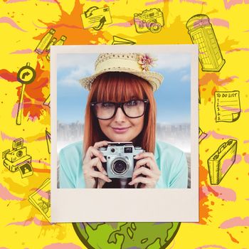 Portrait of a smiling hipster woman holding retro camera against composite image of mustaches
