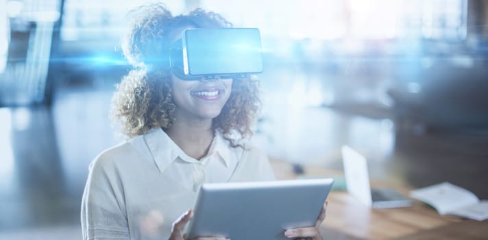 Woman wearing virtual reality glass holding digital tablet in office