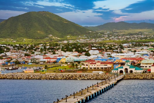 The coast off a tropical island with a commercial pier