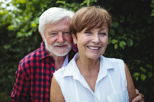 Portrait of senior couple smiling outdoors