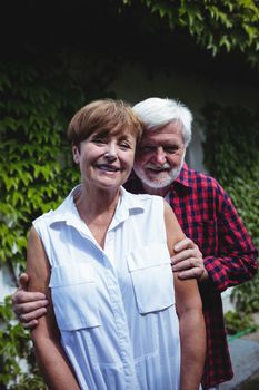 Portrait of senior couple smiling outdoors