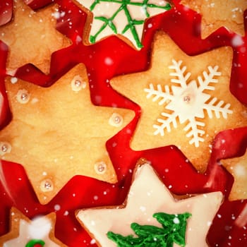 Snow falling against various cookies arranged on plate