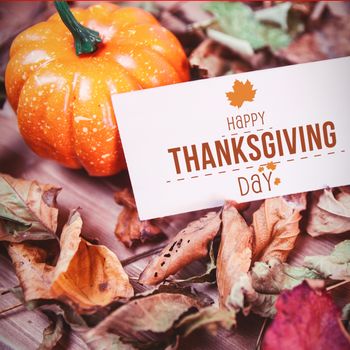 Happy thanksgiving against high angle view of thanksgiving decoration with price tag