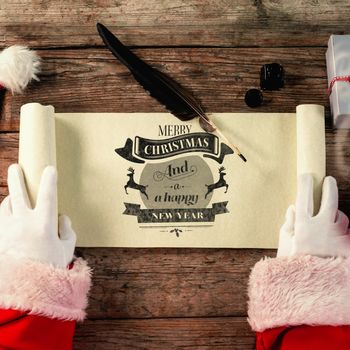 Close-up of santa claus opening scroll against christmas greeting 