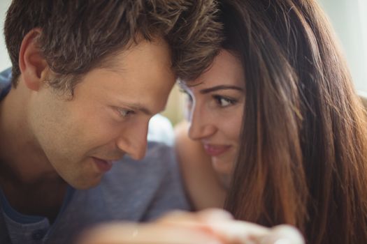 Romantic couple relaxing on bed in bedroom