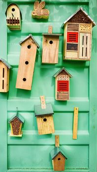 Different types of birdhouses on the wall