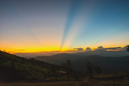 Sunset, mountains and beautiful clouds at Doi Chang, Mae Fah Luang Village, Chiang Rai, Thailand