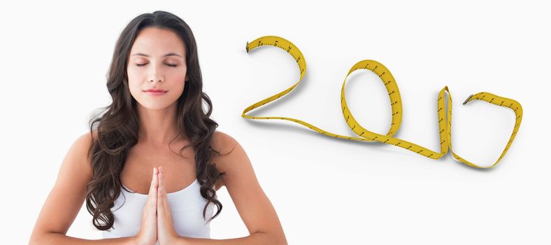 Pretty brunette doing yoga against white background with vignette 3D new year