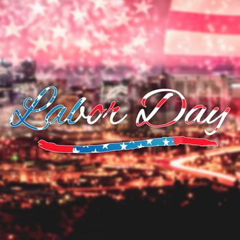 Panoramic shot of labor day text against high angle view of illuminated cityscape