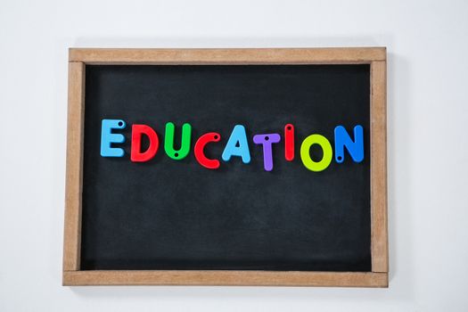 Close-up of letter education block on slate