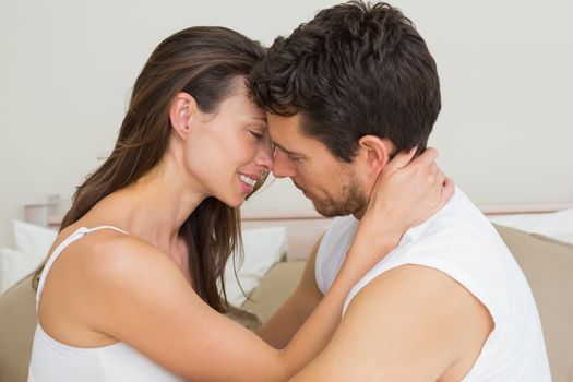 Side view of a romantic young couple at home