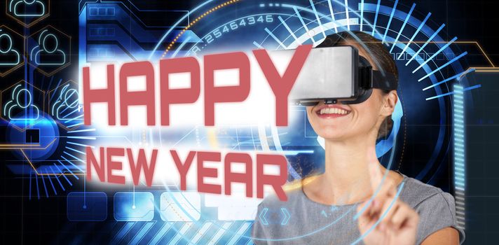Happy young woman using virtual reality headset against technology interface