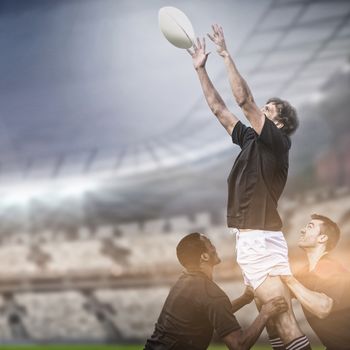 Rugby fans in arena copy space against rugby players jumping for line out 3d 