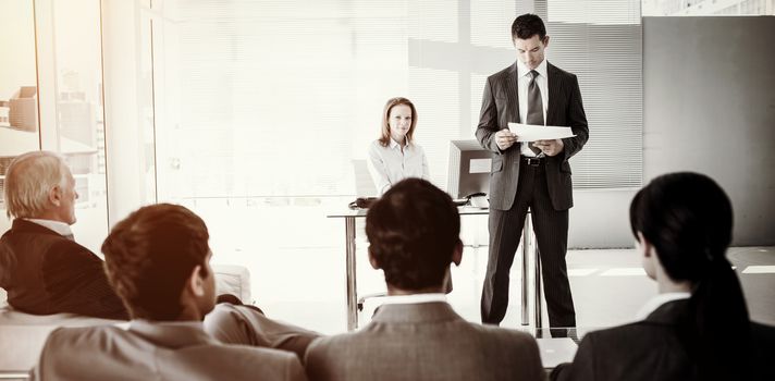 A diverse business people at a conference in an office