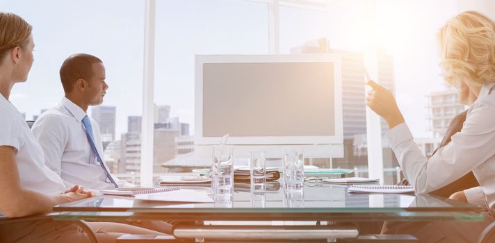 Business people gathered during a video conference in the boardroom