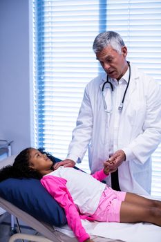 Doctor comforting patient at hospital