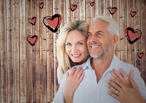 Digital composite image of mature romantic couple and heart graphic