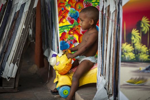 DOMINICUS, DOMINICAN REPUBLIC 6 FEBRAURY 2020: Dominican child plays in the streets of Dominicus