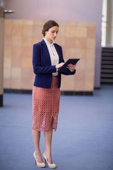 Businesswoman using digital tablet at conference centre