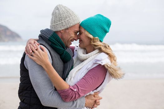 Romantic mature couple embracing each other on the beach