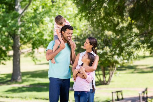 Happy family enjoying in park on a sunny day