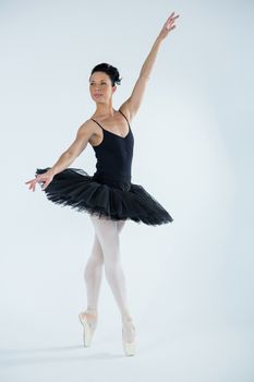 Ballerina practicing ballet dance in the studio