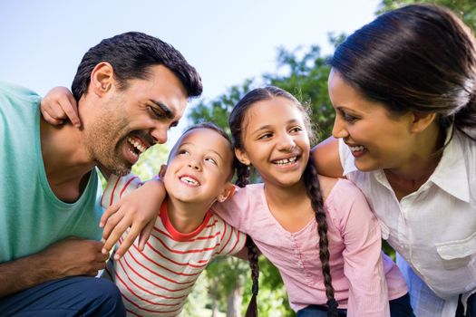 Happy family enjoying in park on a sunny day