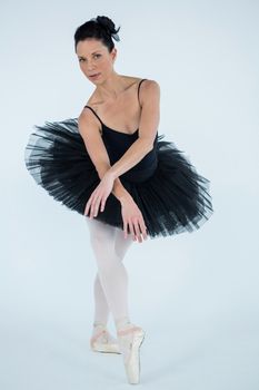 Portrait of ballerina practicing ballet dance in the studio